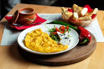 Classic egg omelette served with cherry tomat