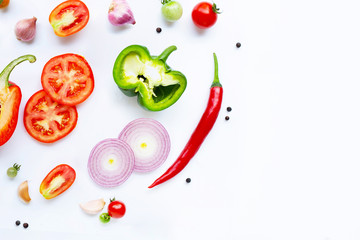 Various fresh vegetables and herbs on white. Healthy eating concept