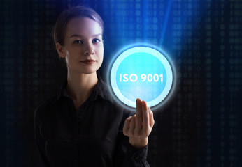The concept of business, technology, the Internet and the network. A young entrepreneur working on a virtual screen of the future and sees the inscription: ISO 9001