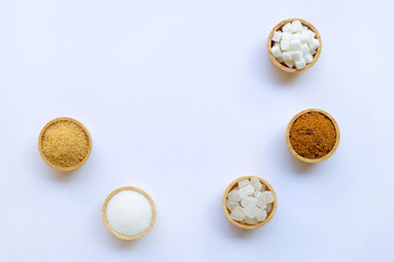 Various types of sugar on white.