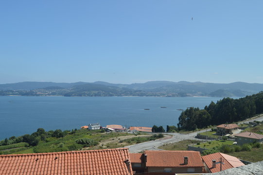 Raxo Bay With The Mussel Hatcheries In It. Nature, Architecture, History. August 19, 2014. Raxo, Pontevedra, Galicia, Spain.
