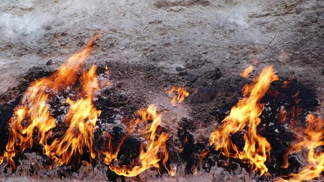  Flame of Yanar Dag (burning mountain). Natural gas is burning on the base of hill.  Azerbaijan.