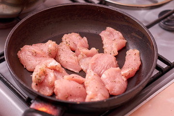 Raw chicken in the pan