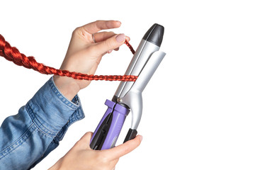 Woman uses professional Ironing tool to style her hair isolated on white background