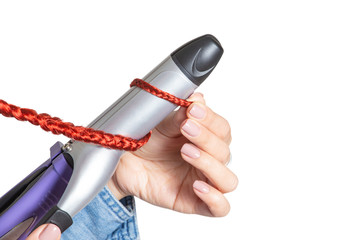 Woman uses professional Ironing tool to style her hair isolated on white background