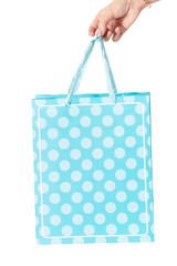 Blue polka dot present bag isolated on white