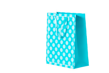 Blue polka dot present bag isolated on white
