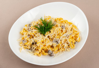 pasta with cheese in a white plate