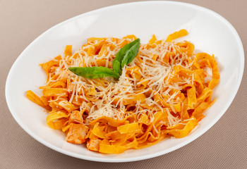 pasta with cheese in a white plate