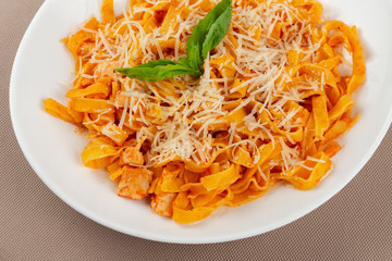 pasta with cheese in a white plate