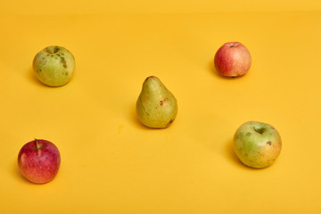 Fresh ripe pears and apples with leaves