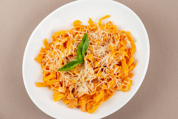 pasta with cheese in a white plate