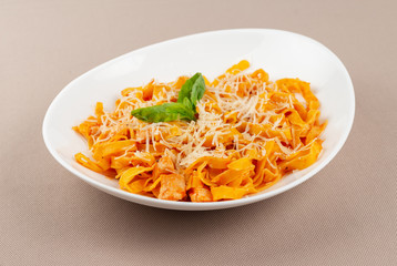 pasta with cheese in a white plate
