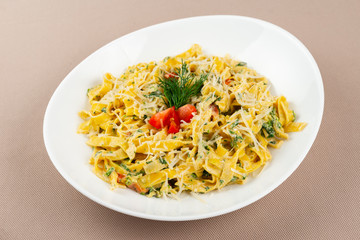 pasta with cheese in a white plate