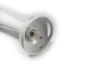 Close-up view of electric hand blender on white background