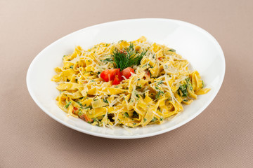pasta with cheese in a white plate