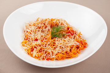 pasta with cheese in a white plate