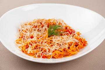 pasta with cheese in a white plate