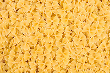 texture of raw farfalle noodles pasta italian food macro background