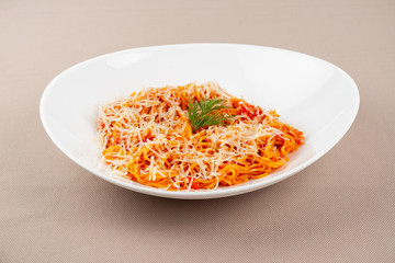 pasta with cheese in a white plate