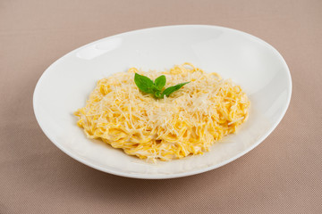 pasta with cheese in a white plate