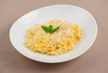 pasta with cheese in a white plate