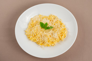 pasta with cheese in a white plate