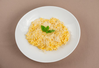 pasta with cheese in a white plate