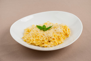 pasta with cheese in a white plate