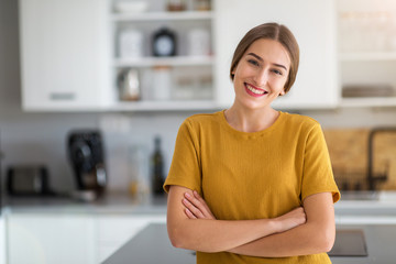 Young woman standing in the kitchen