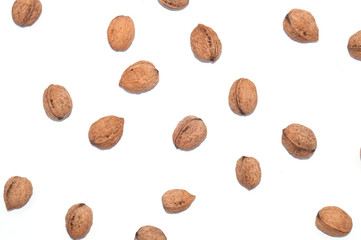 Lots of walnuts on white isolated, top view