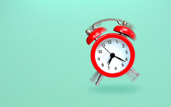 Ringing and bouncing red alarm clock background