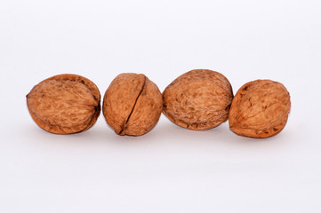 Walnuts on a white background, copy space for text.