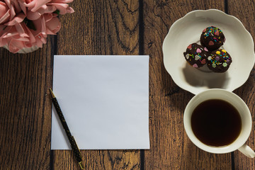 cup of coffee on wooden table