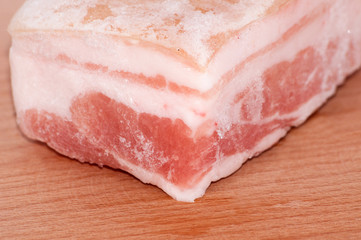 Frozen pork belly macro closeup on cutting board