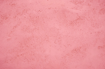 Trend photography on the theme on the actual colors for this season - a shade of orange. Light pink texture of concrete background.