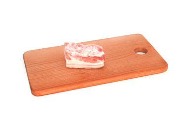 Frozen pork belly, large piece on a cutting board