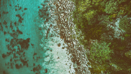 Cathedral Cove coastline at sunset. Amazing overhead aerial view from drone