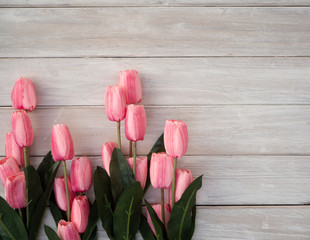 Spring tulips flowers on a old wooden