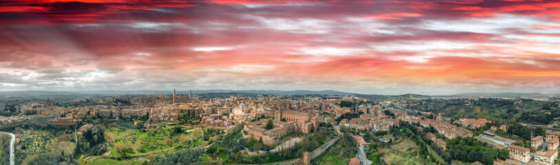 Fototapeta na wymiar Amazing panoramic aerial view of Siena medieval skyline at sunset, Tuscany.