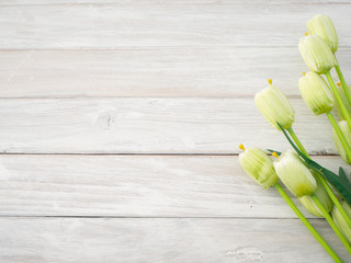 Spring tulips flowers on a old wooden