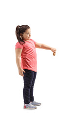 Little girl holding a biscuit and looking down