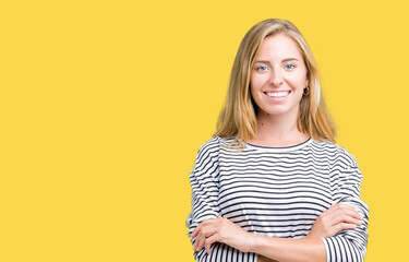 Beautiful young woman wearing stripes sweater over isolated background happy face smiling with crossed arms looking at the camera. Positive person.