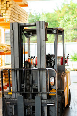 Forklift loader. Pallet stacker truck equipment at warehouse.