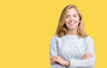 Beautiful young woman wearing winter sweater over isolated background happy face smiling with crossed arms looking at the camera. Positive person.