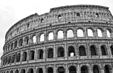 The Coliseum is an oval amphitheatre in the centre of the city of Rome, Italy. It is the largest amphitheatre ever built. Ancient architecture. Landmarks of Italy. Black and White Photography