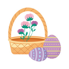 basket wicker with eggs of easter and flowers