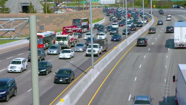 Wide shot of traffic with bus and crane
