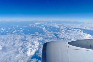 Fototapeta na wymiar Airplane Turbine Engine and Cloudscape. Travel and Transportation