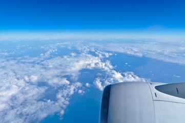Fototapeta na wymiar Airplane Turbine Engine and Cloudscape. Travel and Transportation